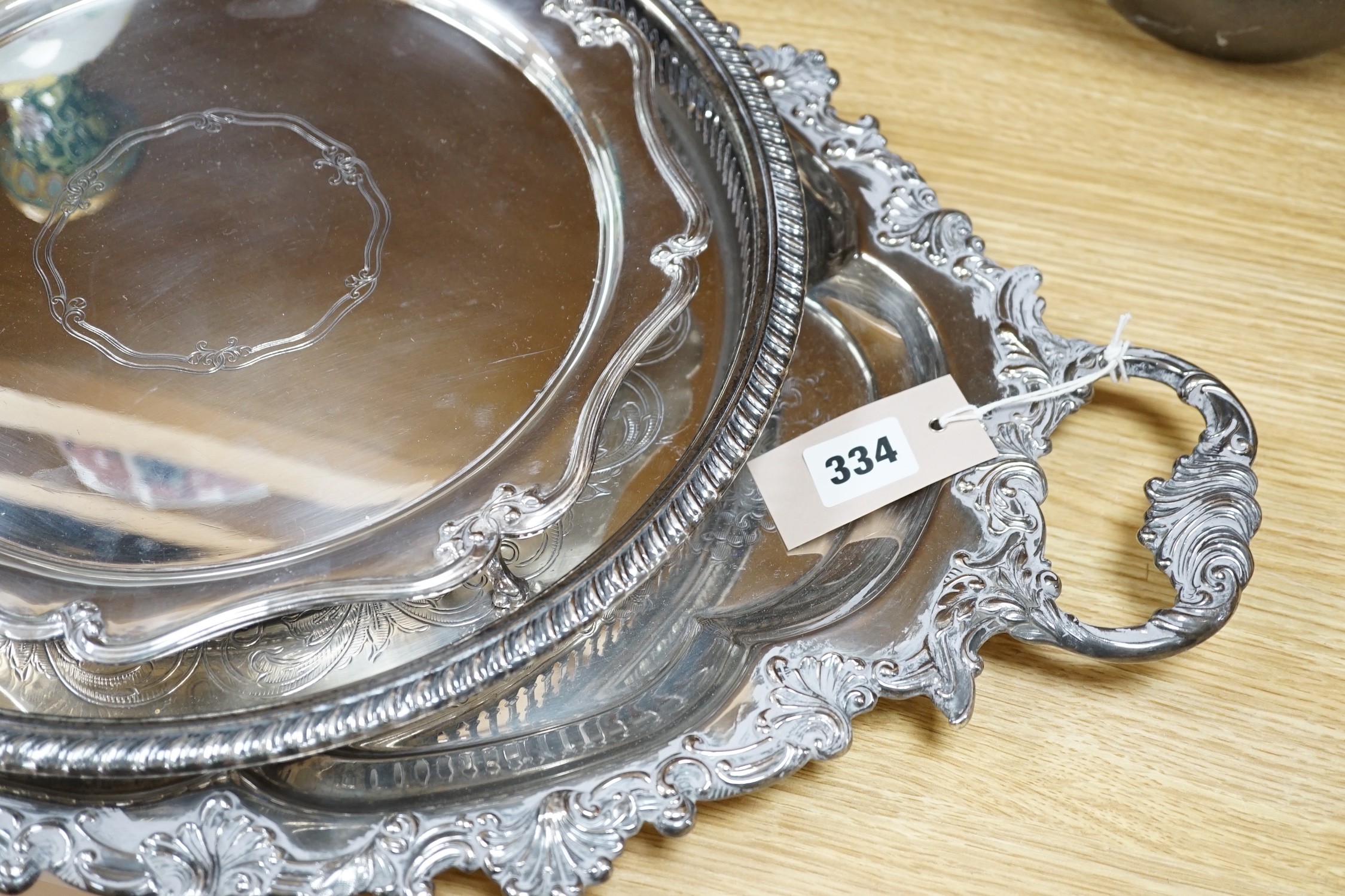 A large Victorian two handled silver plated tray and two others. Largest 65.5cm handle to handle